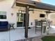 Outdoor patio with ceiling fan, TV, heater, and stylish furniture at 1121 Majestic Canyon St, Henderson, NV 89052