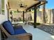 Covered patio featuring ceiling fans, lighting, outdoor furniture, and rock landscaping at 1121 Majestic Canyon St, Henderson, NV 89052