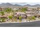 Stunning aerial view of a home nestled in a well-maintained neighborhood with mountain views, showcasing its prime location at 11944 Dolcemente Ln, Las Vegas, NV 89138