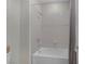 Bathroom showcasing a tiled shower with a gray shower curtain and simple design at 11944 Dolcemente Ln, Las Vegas, NV 89138
