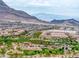 Sweeping community view showcasing parks, manicured landscaping, and mountain views at 11944 Dolcemente Ln, Las Vegas, NV 89138