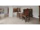 Formal dining room with tile flooring, neutral paint palette, and views into kitchen and backyard pool at 11944 Dolcemente Ln, Las Vegas, NV 89138