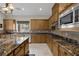 Spacious kitchen with granite countertops, stainless steel appliances, and ample counter space at 11944 Dolcemente Ln, Las Vegas, NV 89138