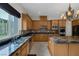 Well-equipped kitchen with granite countertops, a center island, and ample cabinet space at 11944 Dolcemente Ln, Las Vegas, NV 89138