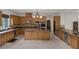 Open concept kitchen with granite countertops, custom cabinets and a center island at 11944 Dolcemente Ln, Las Vegas, NV 89138