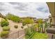 Scenic hillside view featuring desert landscaping and verdant greenery, perfect for enjoying outdoor living at 11944 Dolcemente Ln, Las Vegas, NV 89138