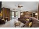 Open living space with access to patio, pool, and modern kitchen at 11944 Dolcemente Ln, Las Vegas, NV 89138