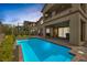 Inviting backyard pool with a patio area, perfect for outdoor entertaining and enjoying sunny days at 11944 Dolcemente Ln, Las Vegas, NV 89138