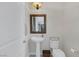 Clean powder room featuring a pedestal sink and modern fixtures at 11944 Dolcemente Ln, Las Vegas, NV 89138