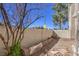 Backyard features a brick perimeter and a minimalist, low-maintenance landscape at 1425 Bow Creek Ct, Las Vegas, NV 89128