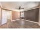 Bright bedroom features a large window, ceiling fan, and a walk-in closet at 1425 Bow Creek Ct, Las Vegas, NV 89128