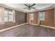 Spacious bedroom features three large windows that provide ample natural light at 1425 Bow Creek Ct, Las Vegas, NV 89128