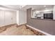 View from living area into kitchen with stainless steel appliances and eat-in bar at 1425 Bow Creek Ct, Las Vegas, NV 89128