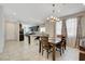 Open dining area showcases a seamless flow into the kitchen, perfect for entertaining at 1634 Deep Valley Ave, North Las Vegas, NV 89084