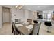 Bright dining area featuring an elegant light fixture and tile flooring at 1634 Deep Valley Ave, North Las Vegas, NV 89084