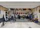 Spacious garage featuring ample storage, work out equipment and room for multiple vehicles at 1634 Deep Valley Ave, North Las Vegas, NV 89084