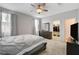 Bright main bedroom with walk-in closet, dresser, and soft carpet at 1634 Deep Valley Ave, North Las Vegas, NV 89084