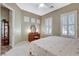 Bedroom with a ceiling fan, carpeted floors, natural light, and a vanity at 1637 Wellington Springs Ave, Henderson, NV 89052