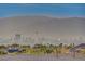 City view from rooftop showcasing buildings and mountains in the distance at 1637 Wellington Springs Ave, Henderson, NV 89052