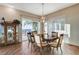 An adjacent breakfast area boasts a modern chandelier and access to the backyard through a glass sliding door at 1637 Wellington Springs Ave, Henderson, NV 89052