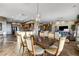 Bright dining area boasts a stylish light fixture and wood-look tile flooring throughout the open concept space at 1637 Wellington Springs Ave, Henderson, NV 89052