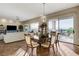 Open-concept dining area with view to mountains and pool at 1637 Wellington Springs Ave, Henderson, NV 89052