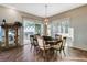 Dining room with a table, a modern light fixture, outdoor view and an elegant china cabinet at 1637 Wellington Springs Ave, Henderson, NV 89052