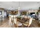 Bright dining area boasts a stylish light fixture and wood-look tile flooring throughout the open concept space at 1637 Wellington Springs Ave, Henderson, NV 89052