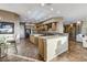 The kitchen includes wood floors, granite counters, stainless steel appliances, and decor lighting at 1637 Wellington Springs Ave, Henderson, NV 89052