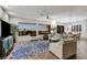 Bright living room with scenic views, modern furniture, and a cozy seating area at 1637 Wellington Springs Ave, Henderson, NV 89052