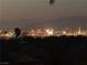 Night view of the city lights with desert mountains in the background at 1637 Wellington Springs Ave, Henderson, NV 89052
