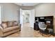 Inviting office with sofa, desk and chair, offering a comfortable workspace with hardwood floors at 1637 Wellington Springs Ave, Henderson, NV 89052