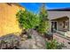 Side yard features a stone pathway leading to the backyard with mature trees at 1637 Wellington Springs Ave, Henderson, NV 89052
