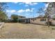 Spacious backyard with an enclosed sunroom, offering outdoor living and relaxation at 1674 Palma Vista Ave, Las Vegas, NV 89169