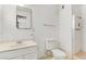 Bathroom with standard toilet, vanity, mirror, and standing shower at 1674 Palma Vista Ave, Las Vegas, NV 89169