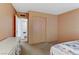 Modest bedroom with built-in closet, carpet, and standard fixtures at 1674 Palma Vista Ave, Las Vegas, NV 89169