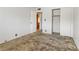 Simple bedroom with sliding closet doors and standard electrical fixtures at 1674 Palma Vista Ave, Las Vegas, NV 89169