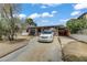 Driveway with view of the house featuring a unique stone exterior at 1674 Palma Vista Ave, Las Vegas, NV 89169