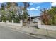 View of the home, showcasing the front yard and driveway at 1674 Palma Vista Ave, Las Vegas, NV 89169