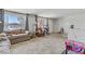 Sun-drenched living room featuring neutral paint, and open floor plan at 1674 Palma Vista Ave, Las Vegas, NV 89169