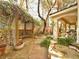 Secluded backyard featuring a charming pergola, lush landscaping, and a serene ambiance at 1753 Tanner Cir, Henderson, NV 89012