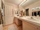 Bathroom with double vanity, tiled countertop, and ample storage at 1753 Tanner Cir, Henderson, NV 89012