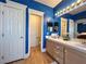 Bright bathroom features dual sinks, mirrors and updated fixtures at 1753 Tanner Cir, Henderson, NV 89012