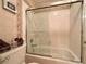 Well-lit bathroom with a shower and tub combination and decorative details at 1753 Tanner Cir, Henderson, NV 89012