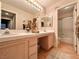 Bright bathroom featuring double sinks, tile countertops, and a separate shower and tub at 1753 Tanner Cir, Henderson, NV 89012