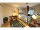 Comfortable bedroom featuring a large canopy bed and light hardwood floors at 1753 Tanner Cir, Henderson, NV 89012