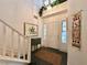 Bright, two-story foyer with a staircase, decorative plants and large windows at 1753 Tanner Cir, Henderson, NV 89012