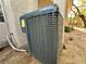 Exterior view of the home's air conditioning unit, with a glimpse of the surrounding yard at 1753 Tanner Cir, Henderson, NV 89012