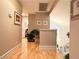 Bright hallway with hardwood floors, neutral paint, and a view of the staircase at 1753 Tanner Cir, Henderson, NV 89012