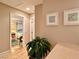 Bright hallway with hardwood floors and views into the rooms of the home at 1753 Tanner Cir, Henderson, NV 89012